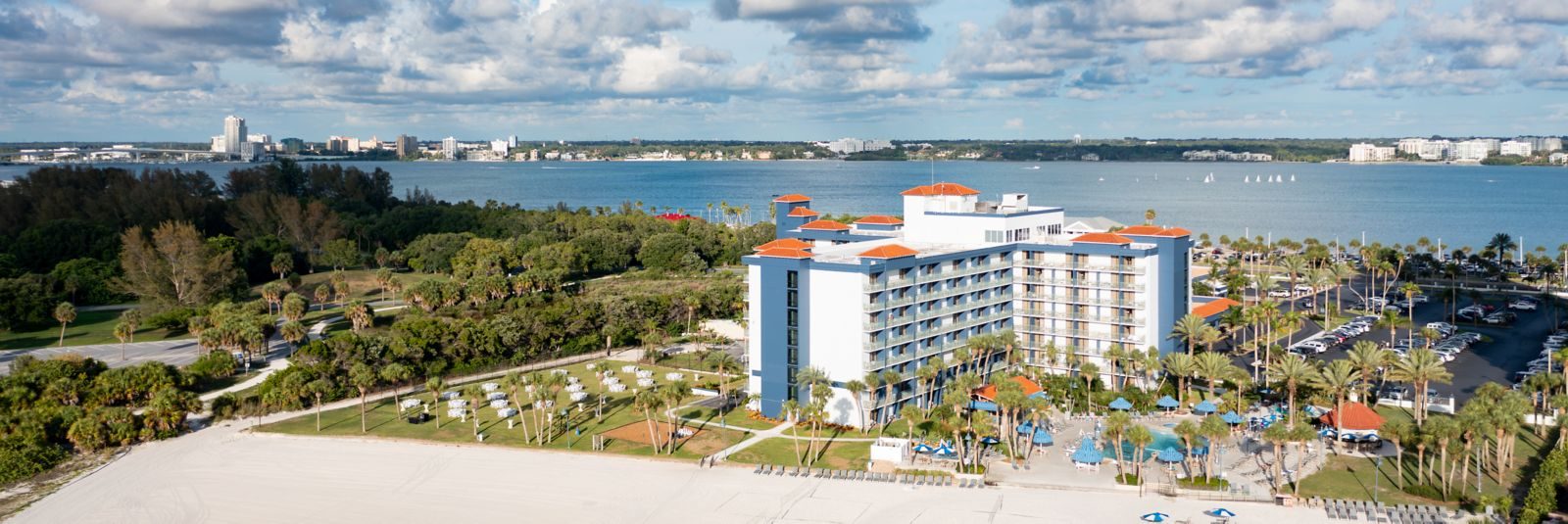 Aerial view of the Sheraton Sand Key Resort on the beach, with Clearwater across the bay
