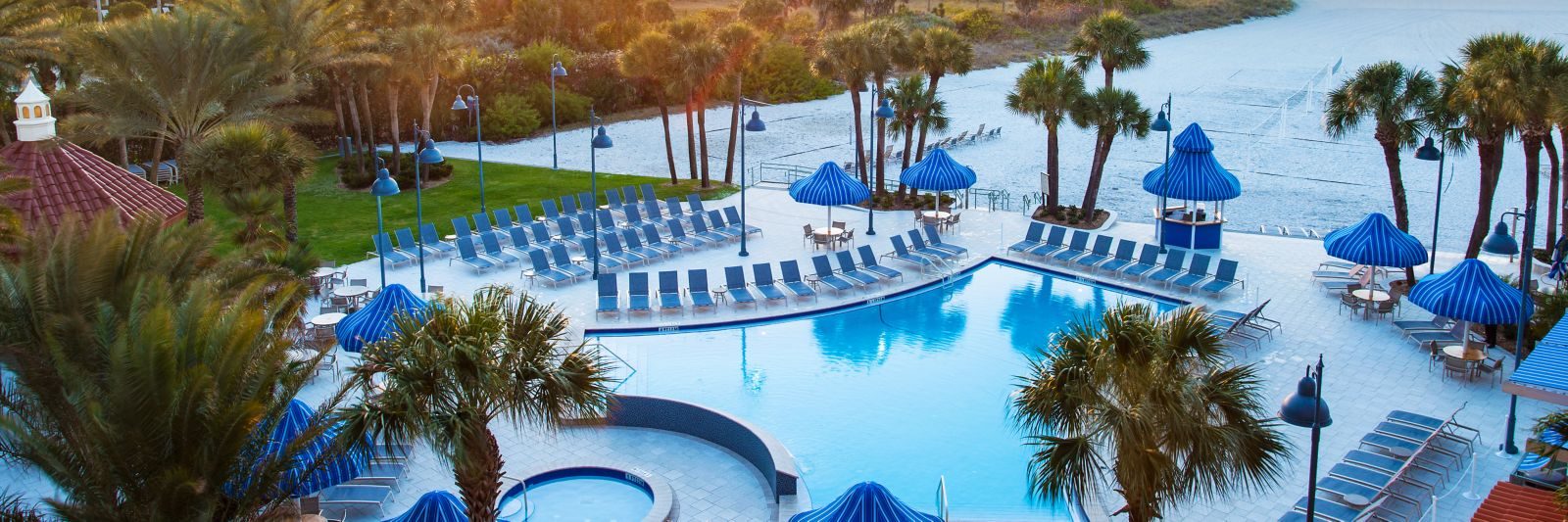 The resort's pool and the beach beyond it